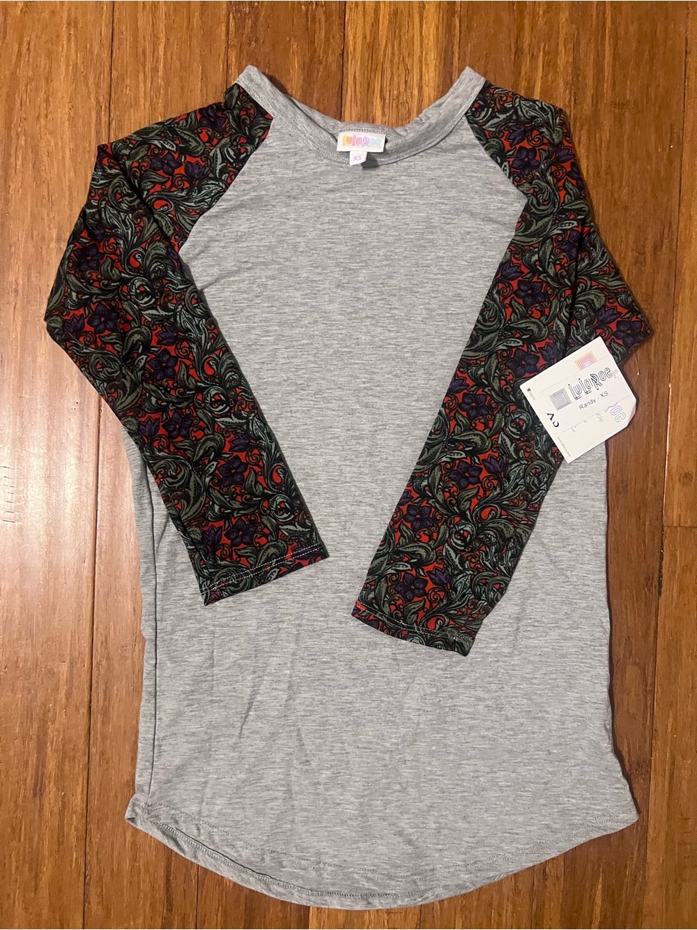 LuLaRoe Gray Raglan Top with Black/Green/Red Patterned Sleeves